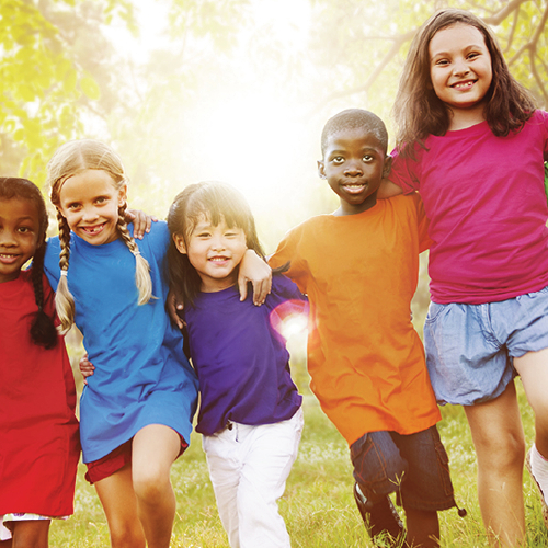 Image of a group of children arm in arm